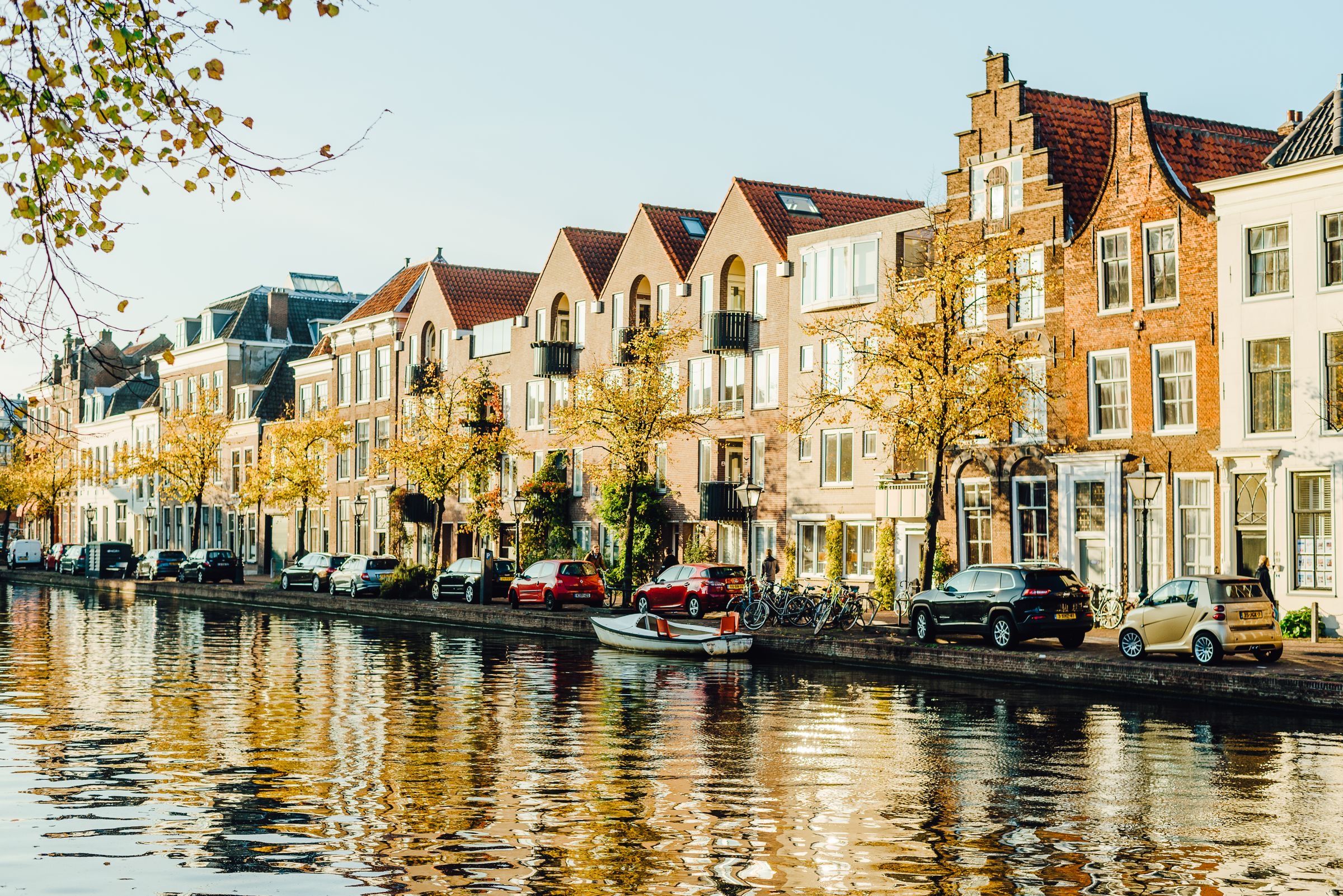 Canal-side office buildings in Amsterdam in daylight, the setting of a regulated business