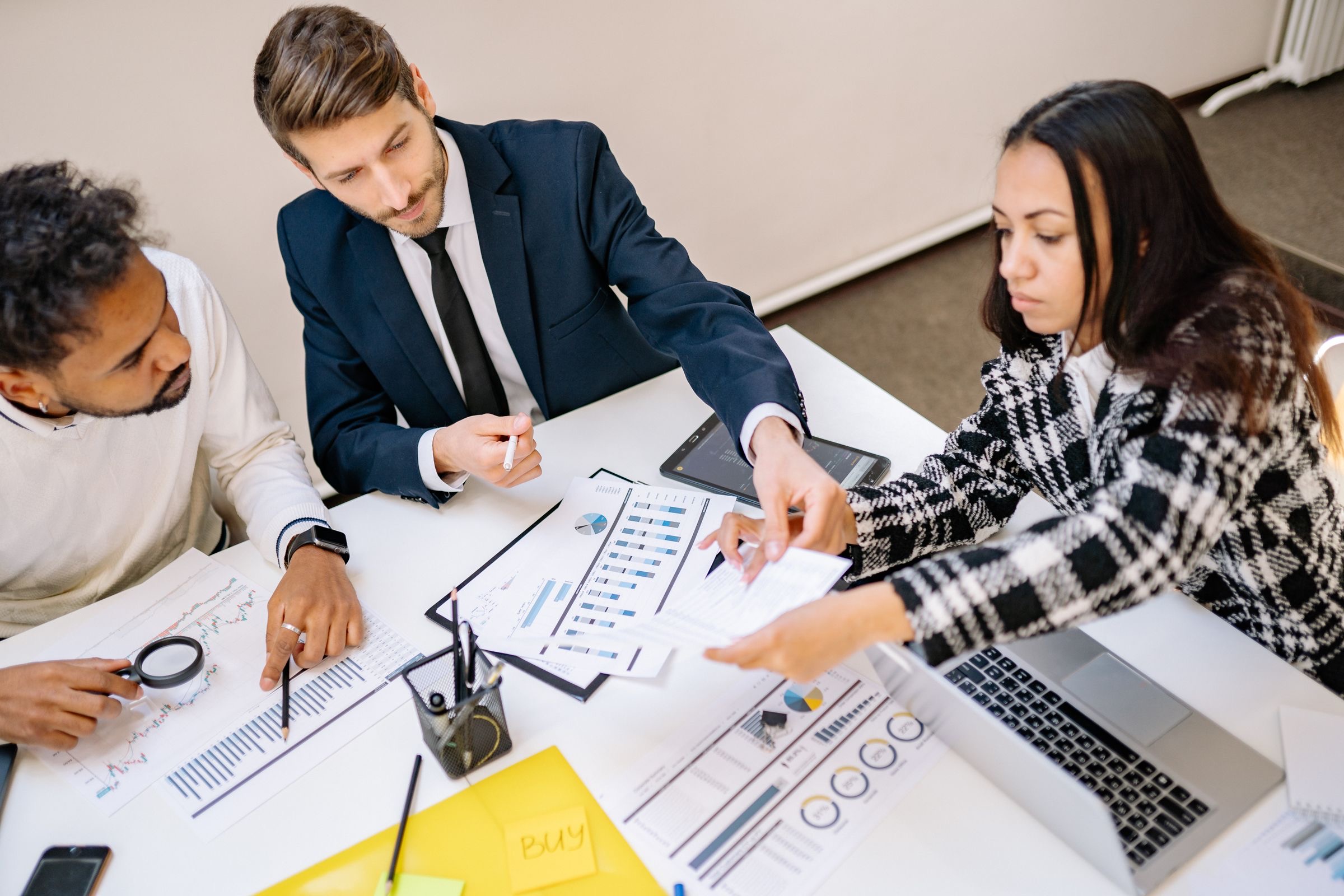 Compliance specialists reviewing an e-money licence application