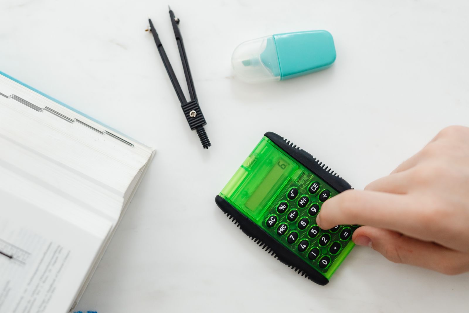 Financial statements and a calculator on a desk as a subsidiary's books are closed during its liquidation